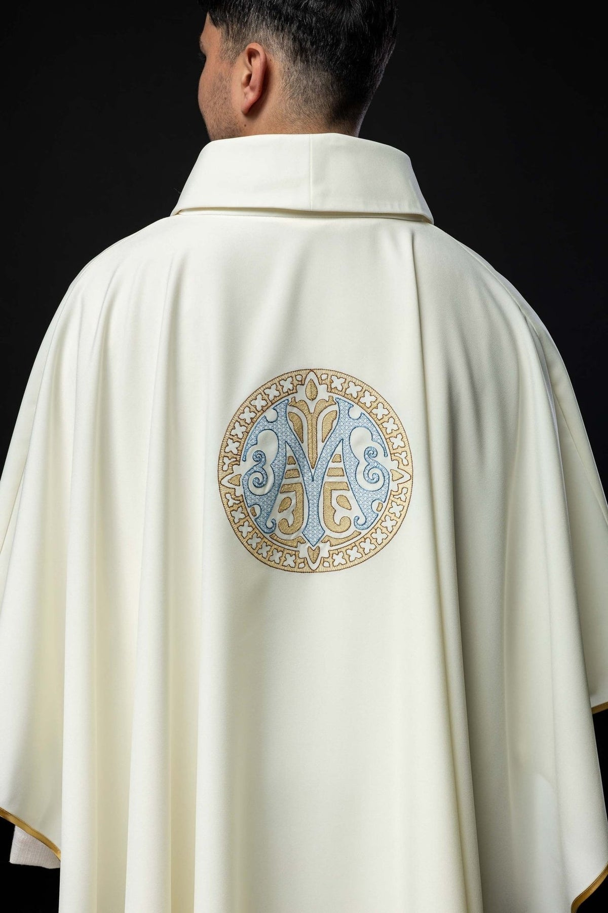Marian chasuble back view showing embroidered Marian motif and gold trim