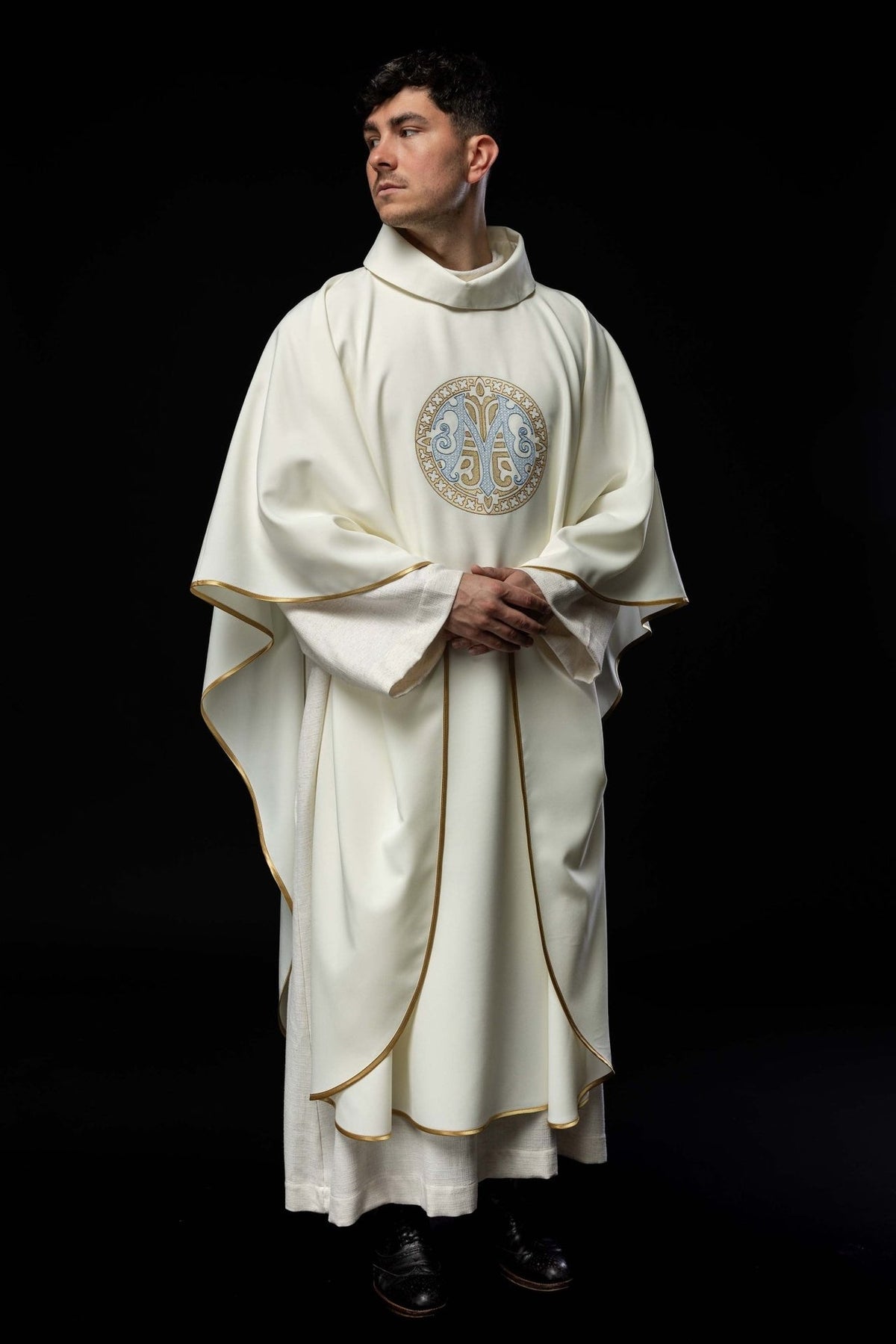 Marian chasuble angled front view showing Marian motif, stand-up collar and gold trim