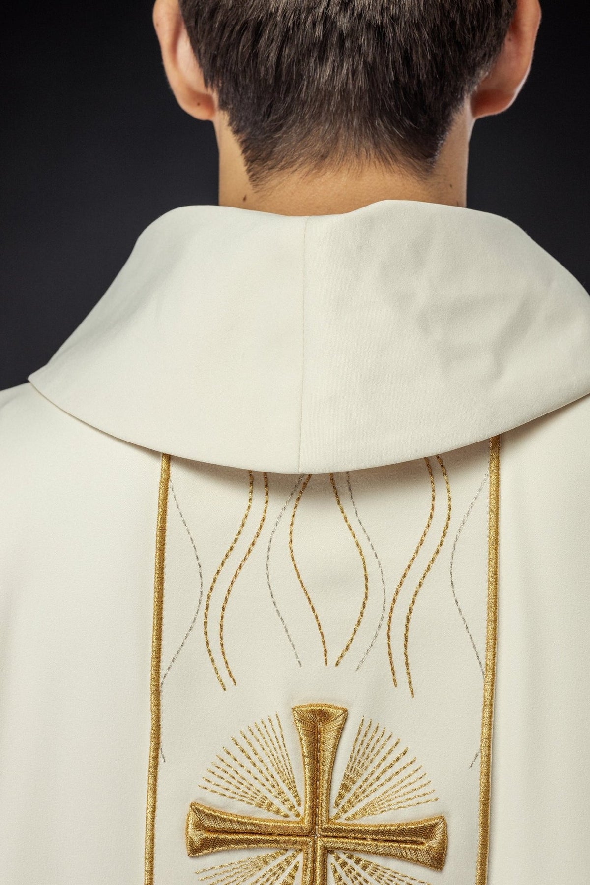 Ecru chasuble sleeve close-up with gold trim and white inner sleeve