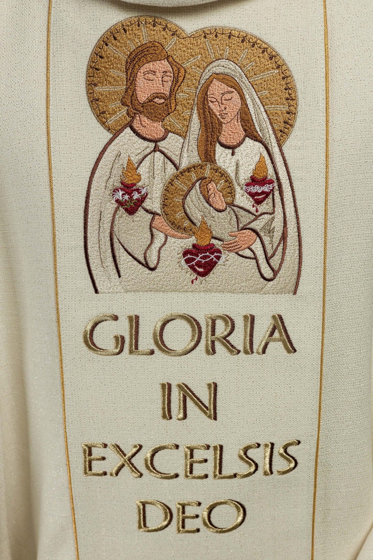 Christmas chasuble close-up of embroidered Holy Family image and Gloria lettering