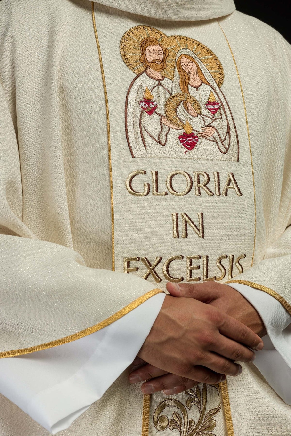 Christmas chasuble angled front close-up with Holy Family embroidery and gold trim