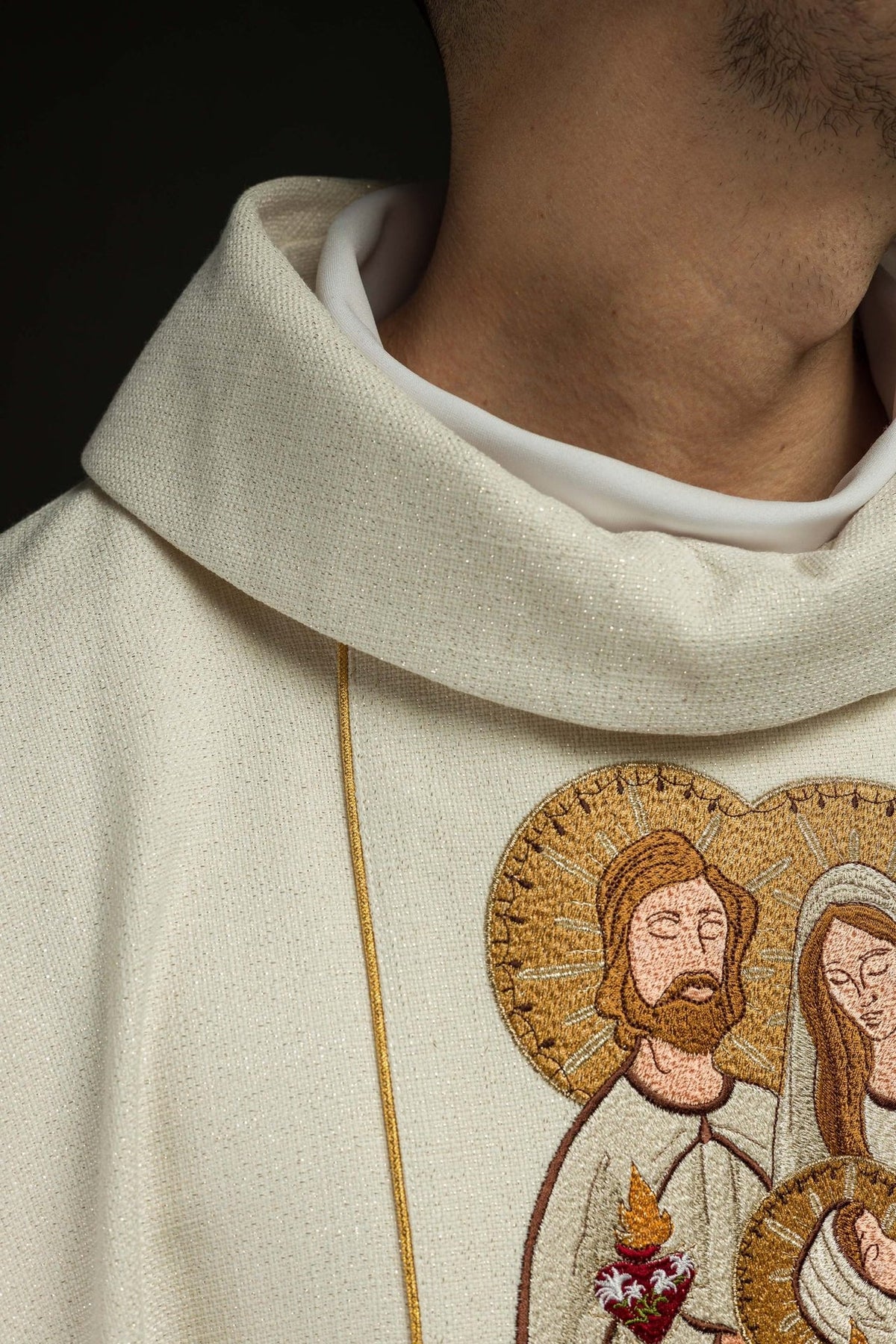 Christmas chasuble close-up showing ivory stand-up collar and Holy Family embroidery