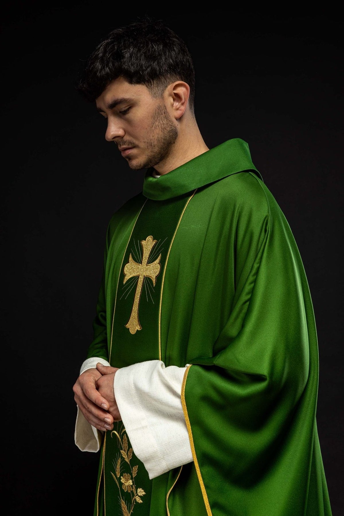 Green chasuble side view with embroidered cross and gold trim