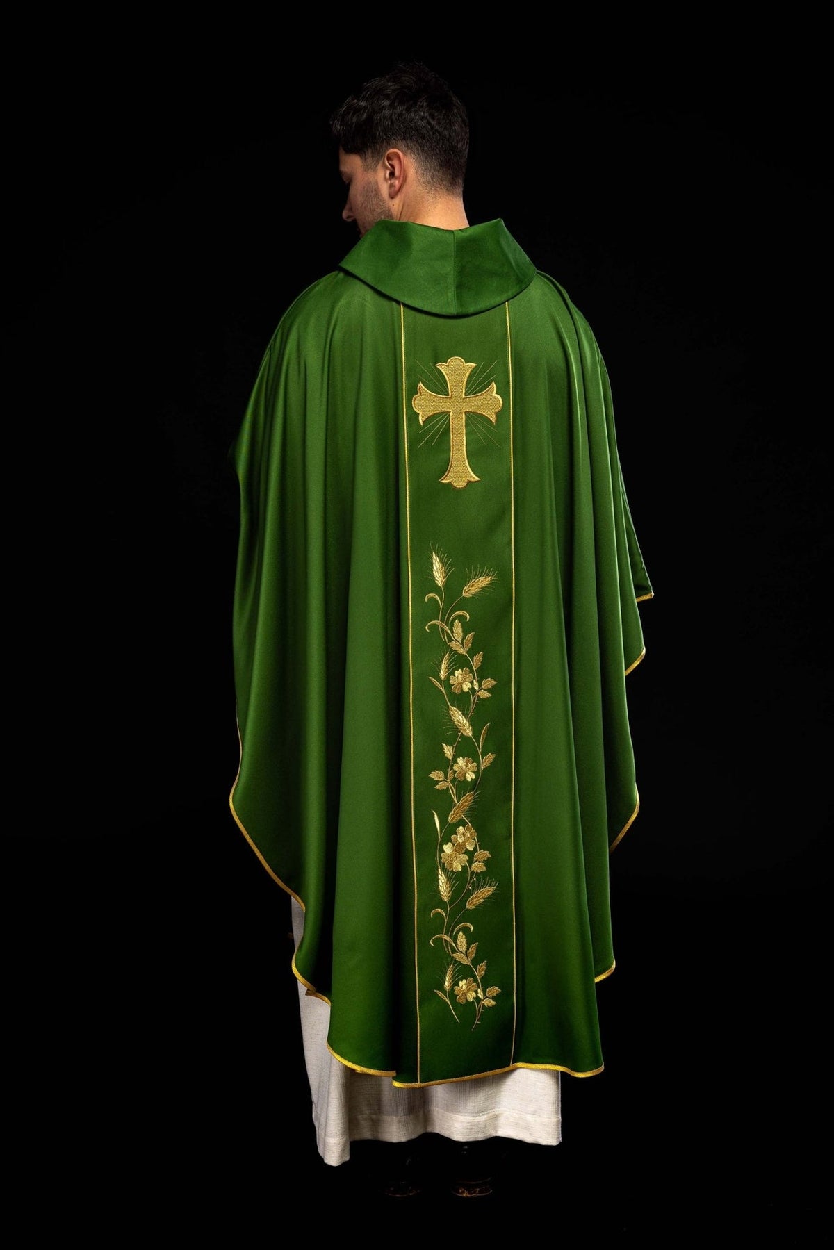 Green chasuble back close-up with gold embroidered cross and wheat