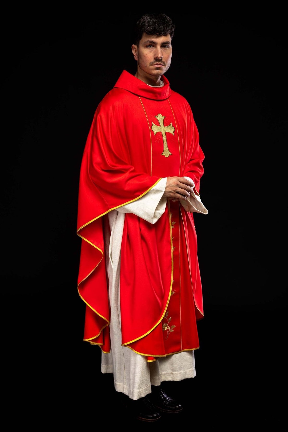 Red chasuble side view with gold trim and front embroidery
