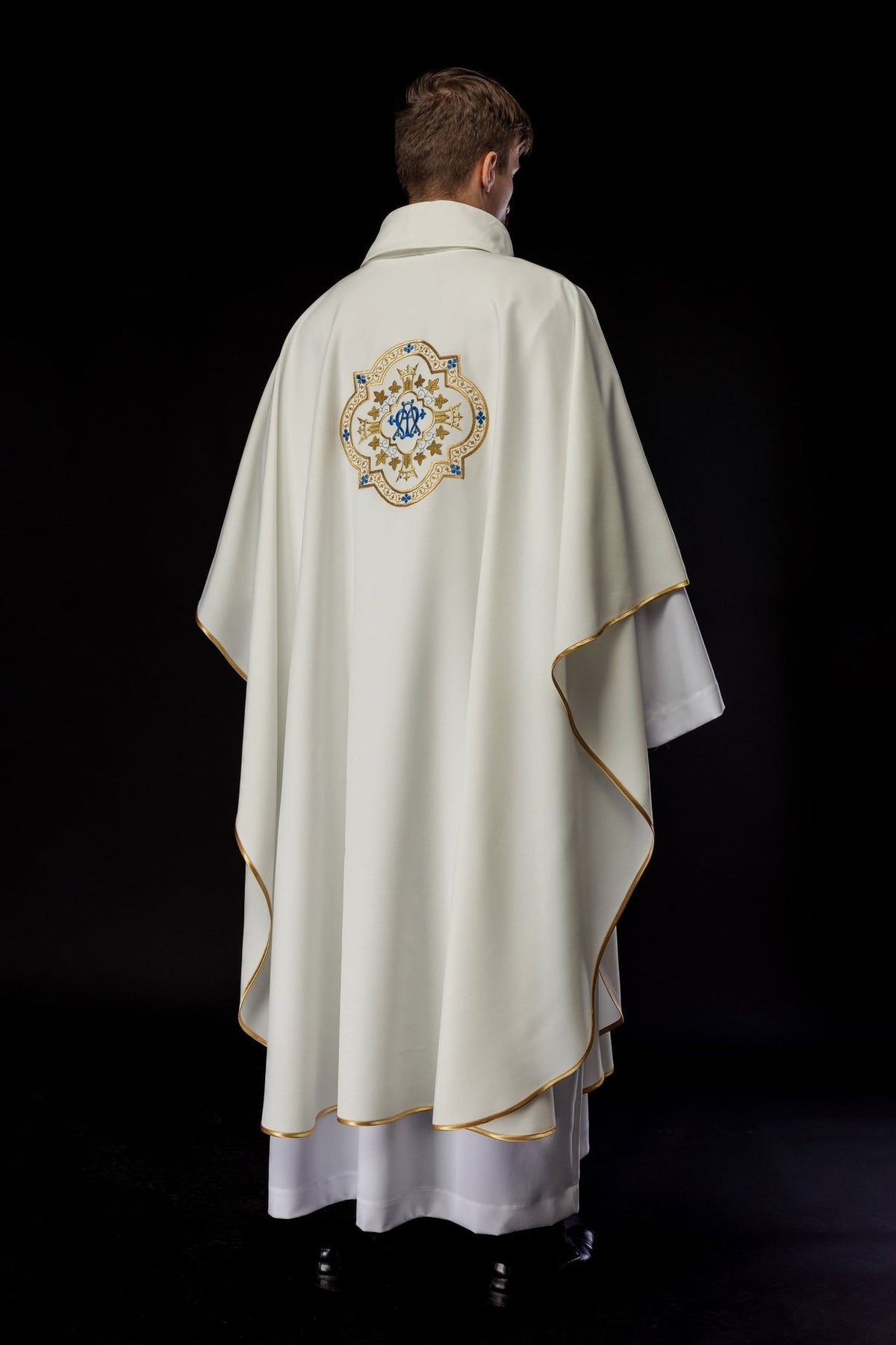 Ecru Marian chasuble, back view with gold trim and central embroidered motif