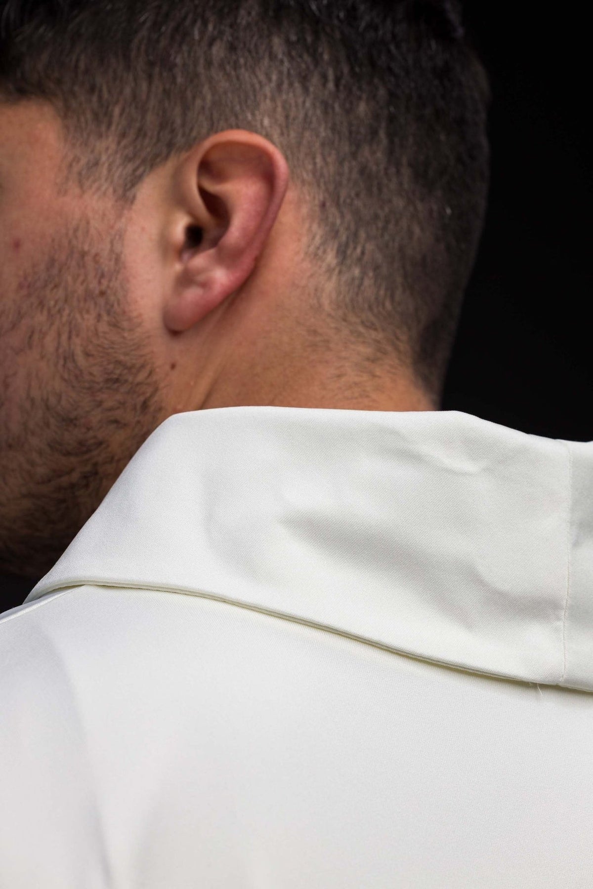 Ecru chasuble close-up showing the stand-up collar