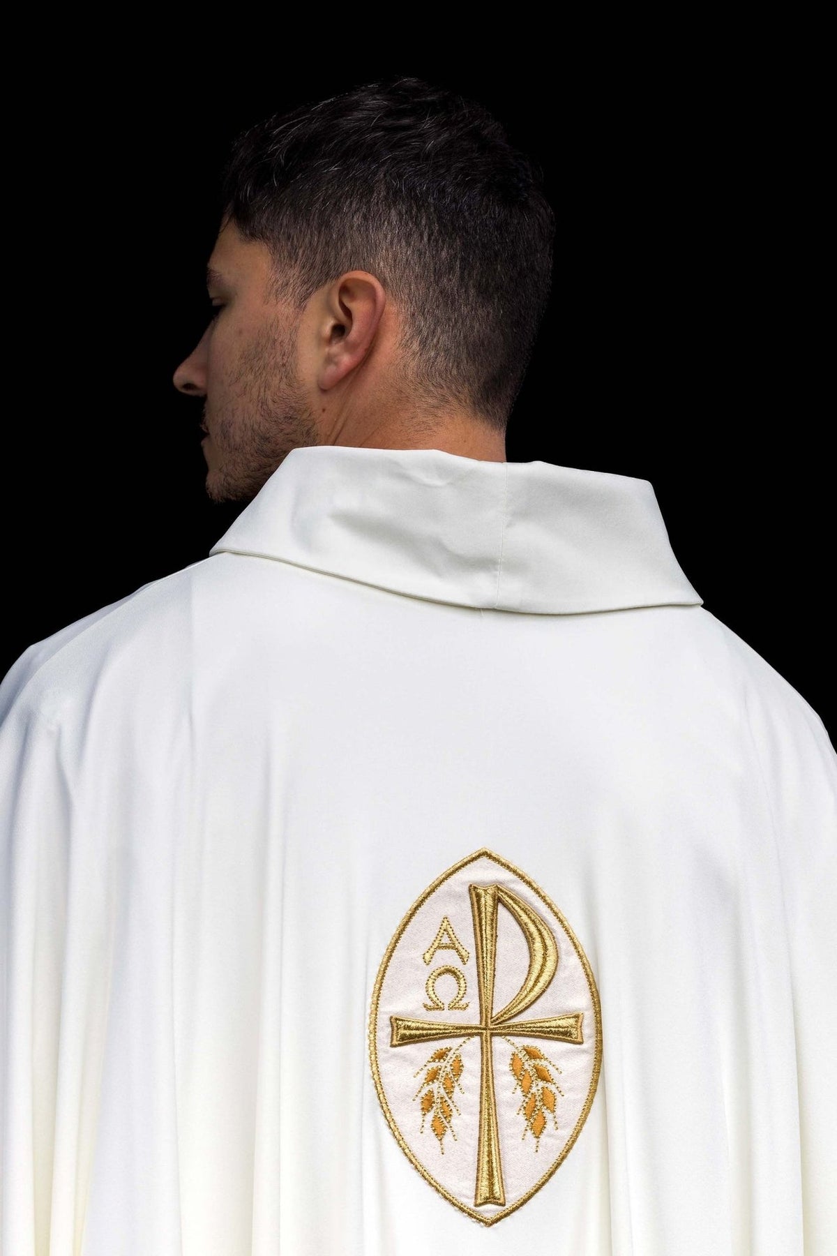 Ecru chasuble back view with gold embroidered cross and stand-up collar