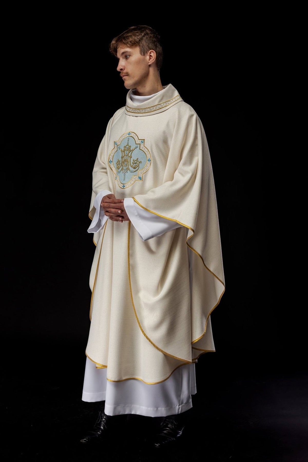 Ecru Marian chasuble, angled front view with embroidered Marian motif