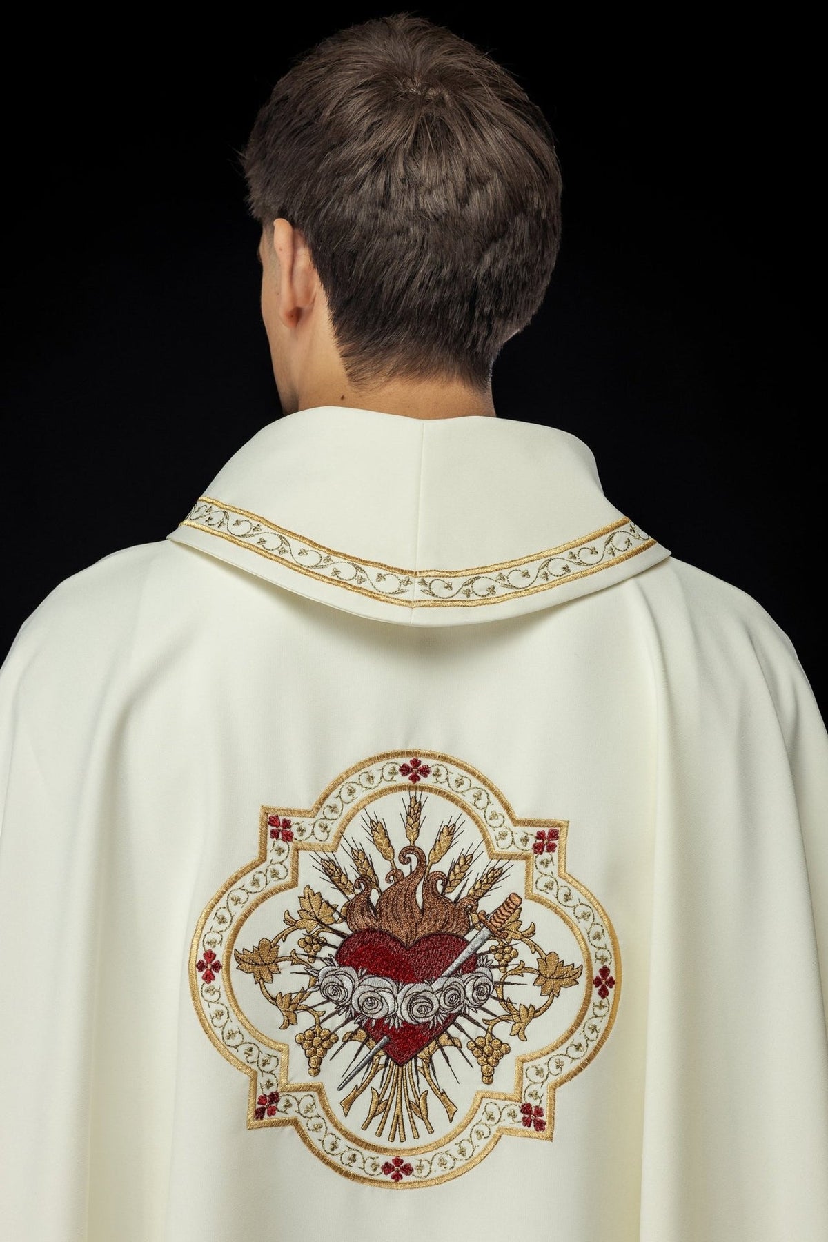 Ecru chasuble back view with Heart of Mary embroidery and gold trim