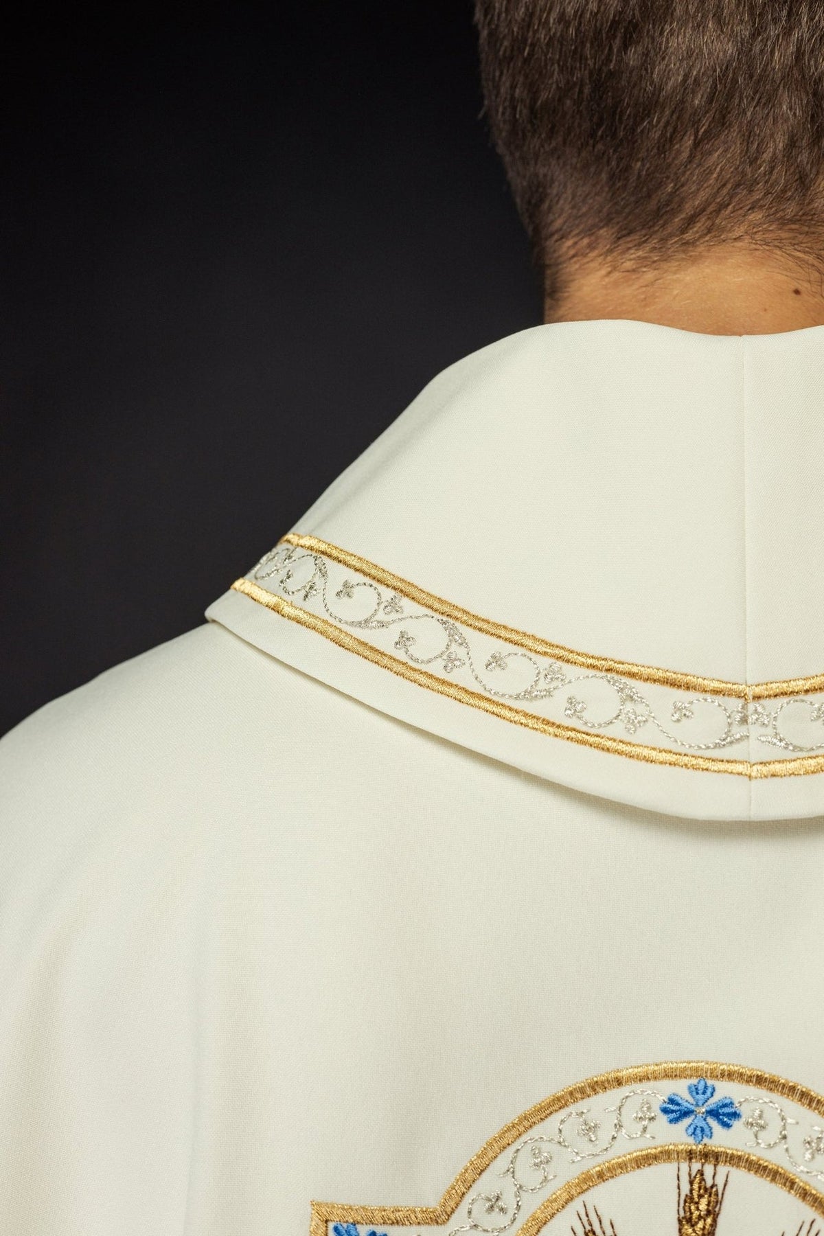 Ecru chasuble close-up of stand-up collar with silver scroll embroidery and gold trim