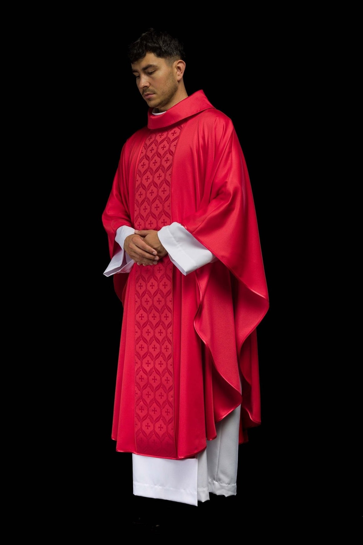 Red chasuble side worn view with flowing sleeves and front orphrey