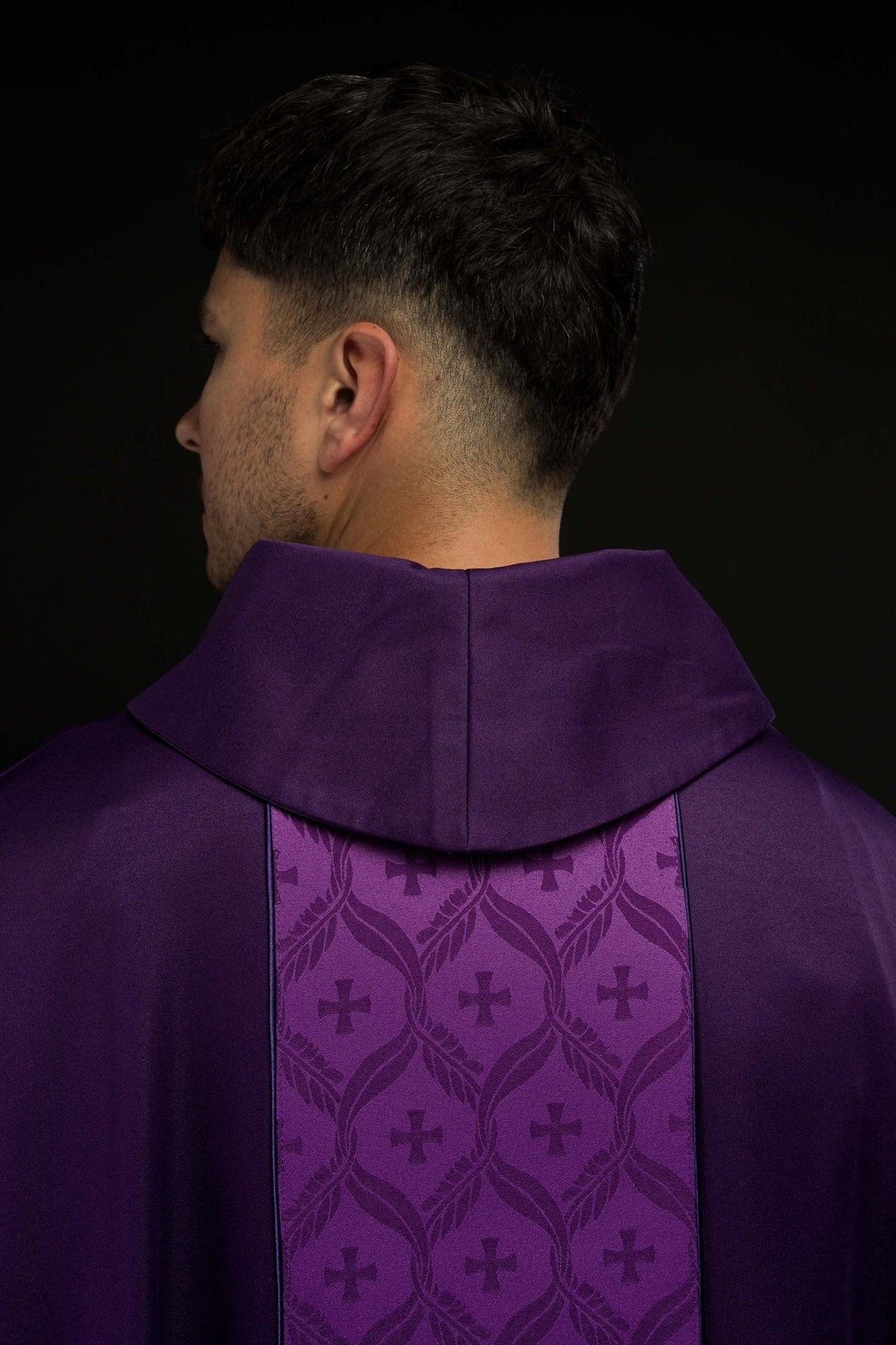 Purple chasuble back detail with jacquard orphrey and crosses