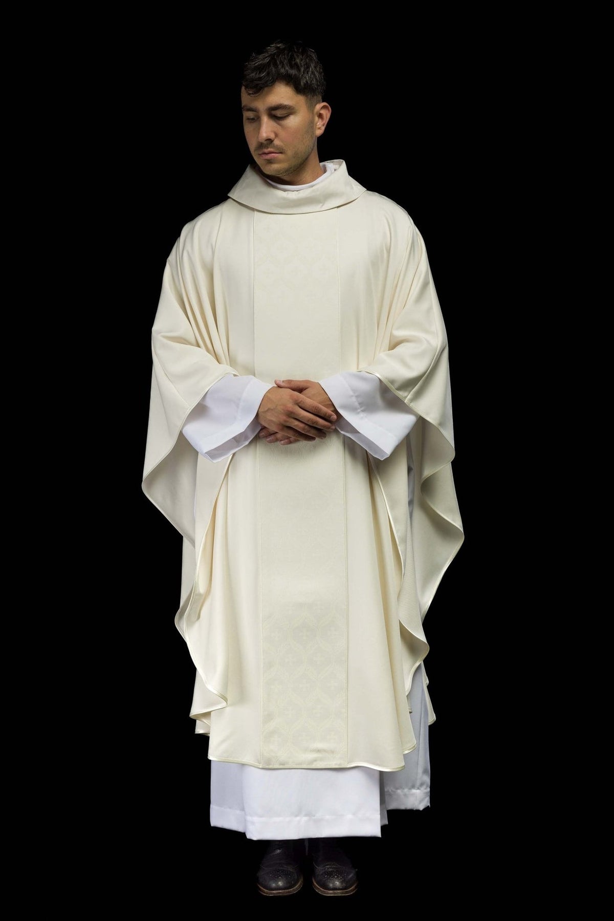 Ecru chasuble front view showing wide sleeves and cross-patterned orphrey
