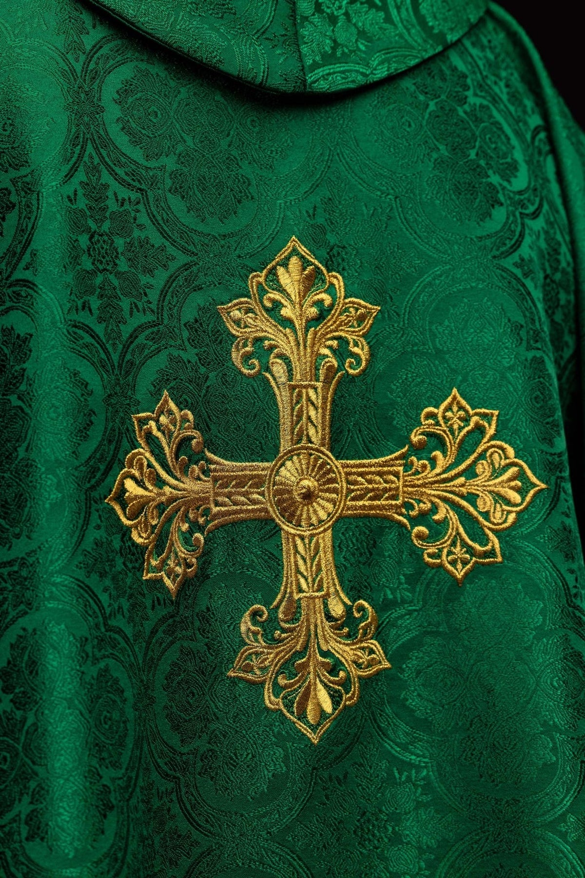Green chasuble front close-up showing gold embroidery and jacquard fabric