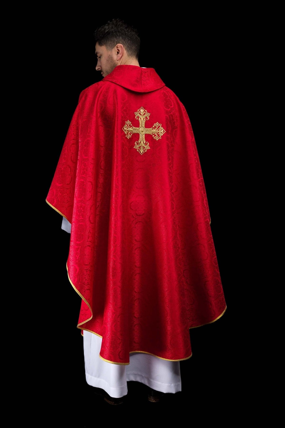 Red chasuble back view with gold embroidered cross and gold trim
