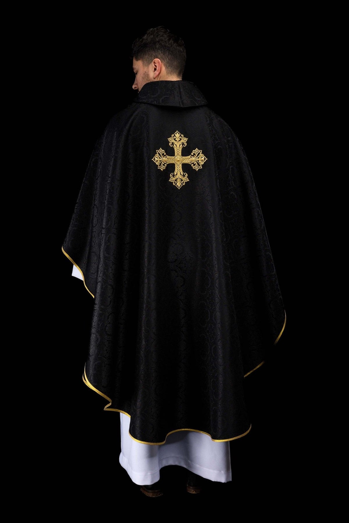 Black chasuble back view with gold cross, jacquard fabric and gold trim