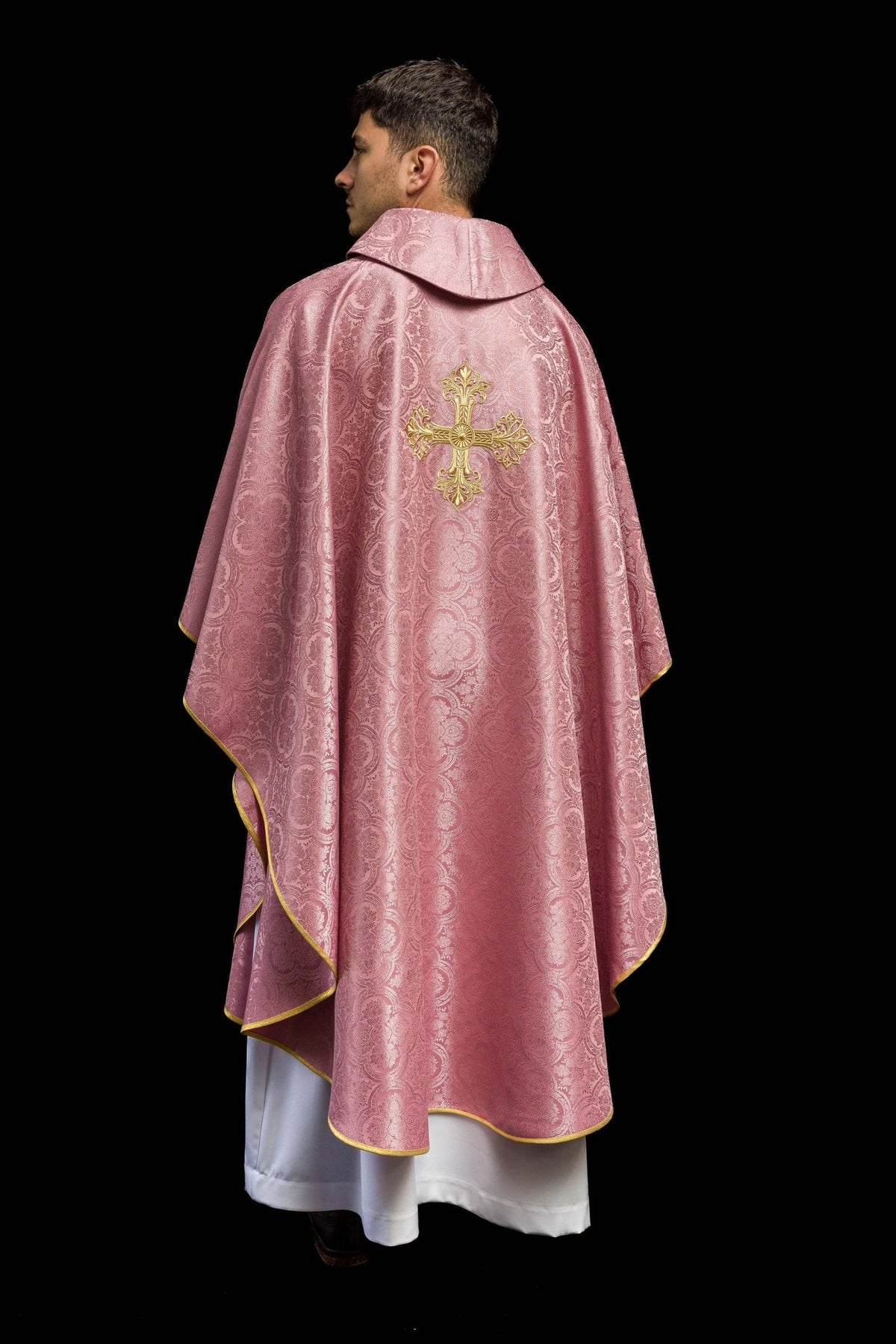 Rose chasuble back view showing gold embroidered cross and gold trim