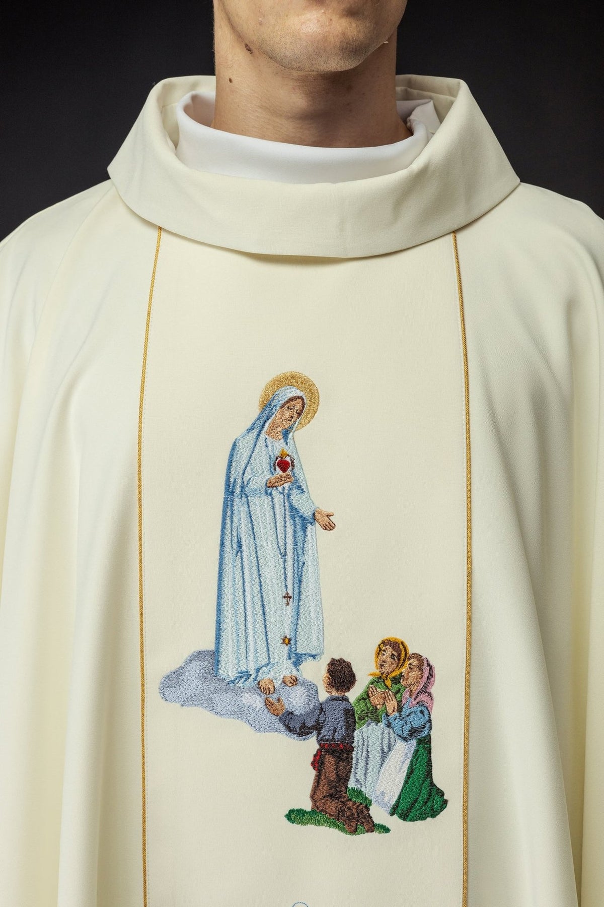 Chasuble close-up showing embroidered Our Lady of Fatima image and stand-up collar