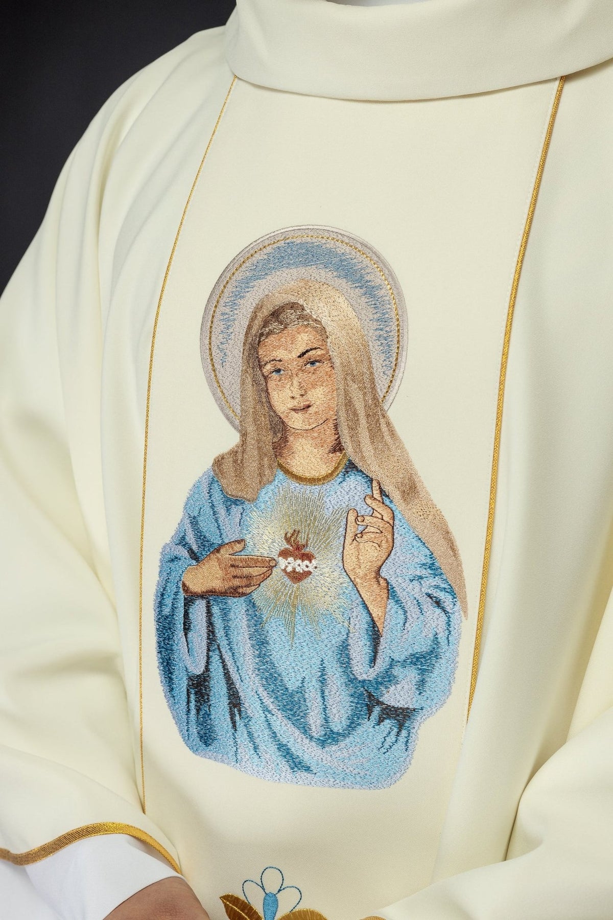 Heart of Mary chasuble close-up showing embroidered blue and gold image