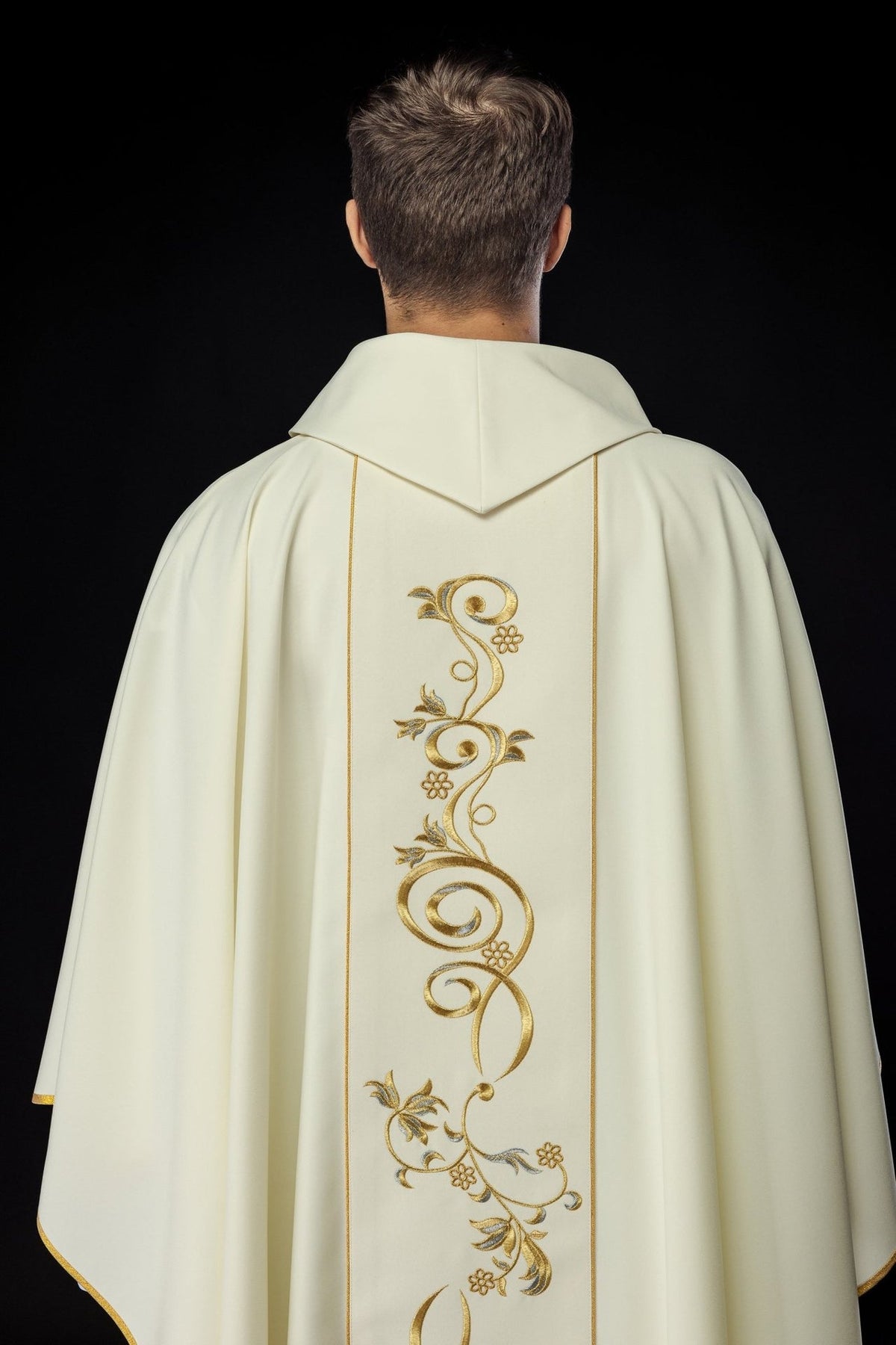 Chasuble back view with gold floral orphrey and ivory stand-up collar
