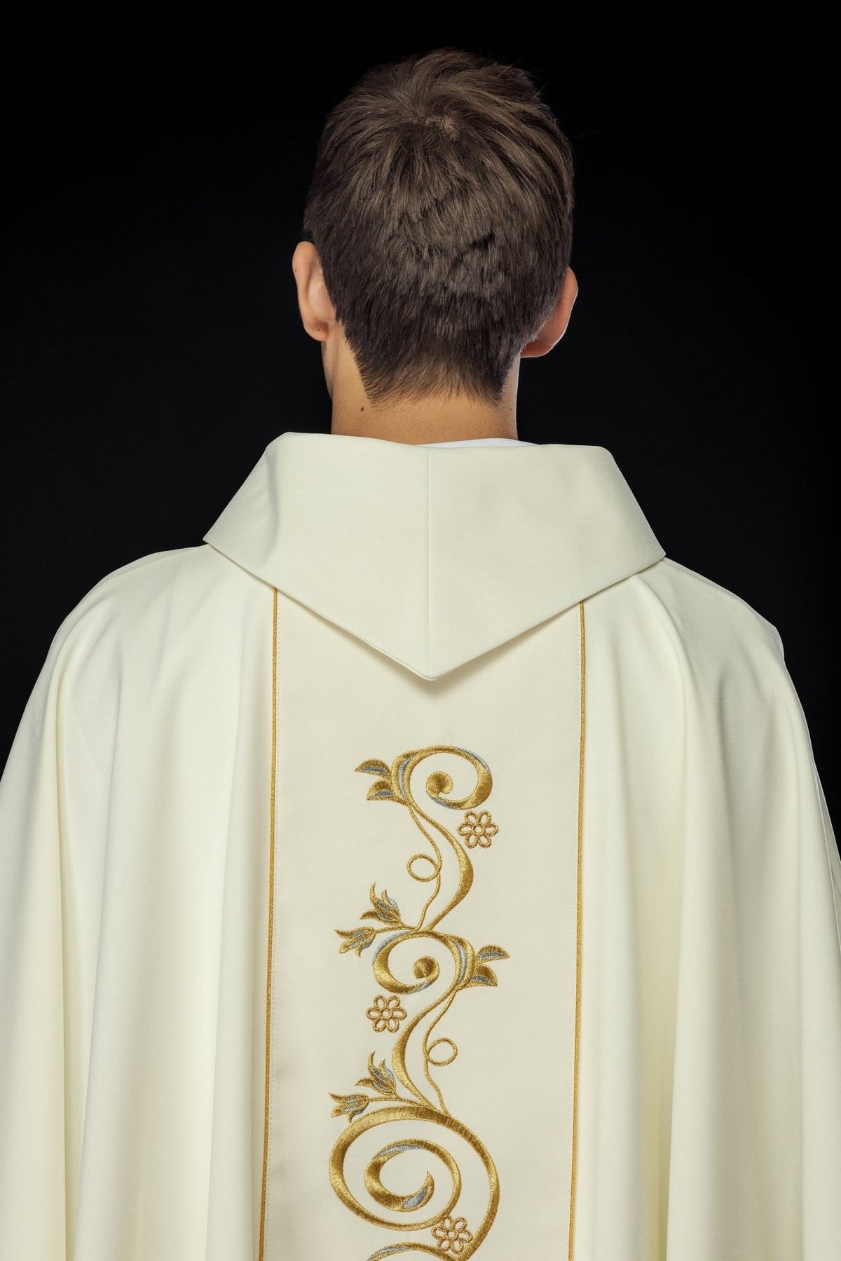 Chasuble back view with gold floral orphrey and ivory stand-up collar