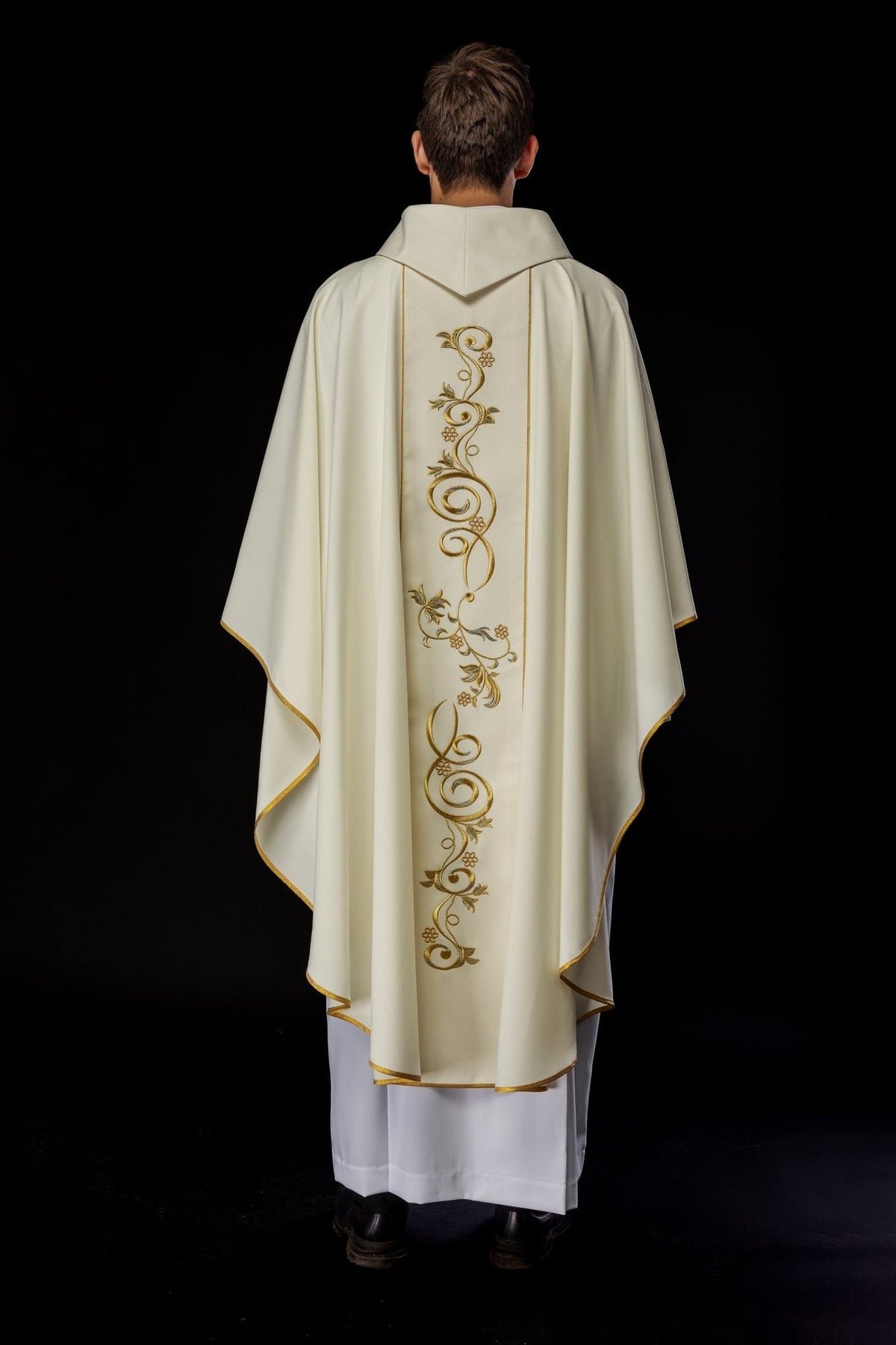 Ivory chasuble back view with embroidered gold and silver floral orphrey