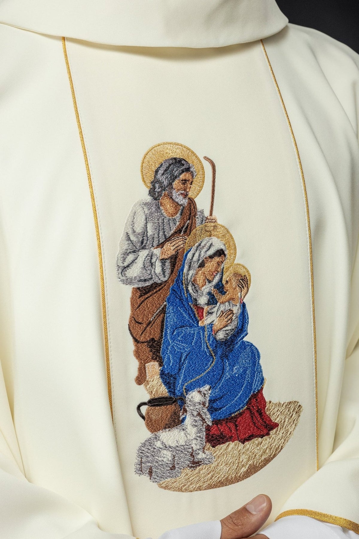 Holy Family chasuble, close-up of colorful embroidered image on ivory fabric