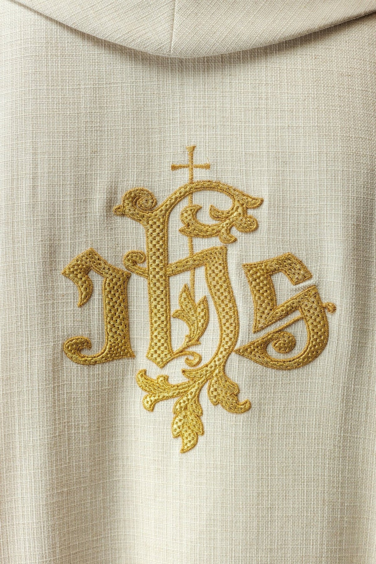Saint Joseph chasuble, close-up of gold embroidered IHS emblem on the back