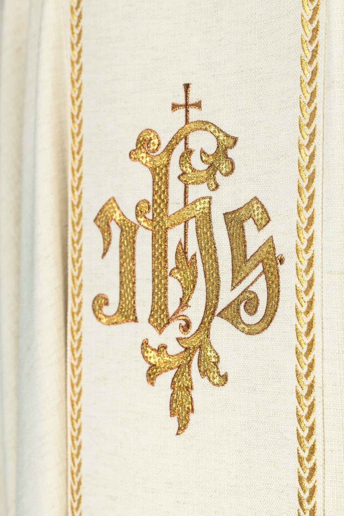 Ecru chasuble back view with gold IHS monogram and floral orphrey