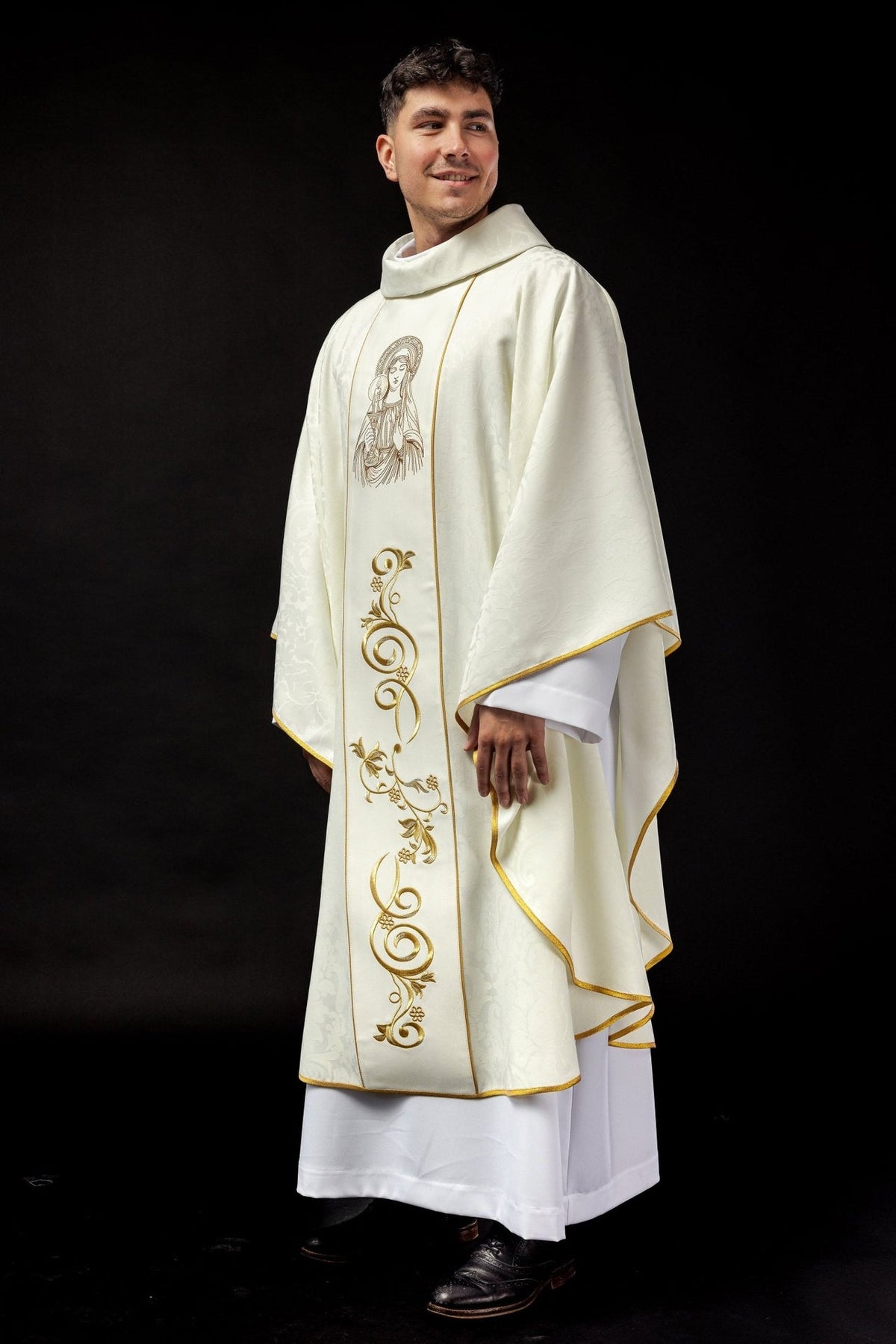 Our Lady chasuble, worn three-quarter view with gold trim and floral embroidery
