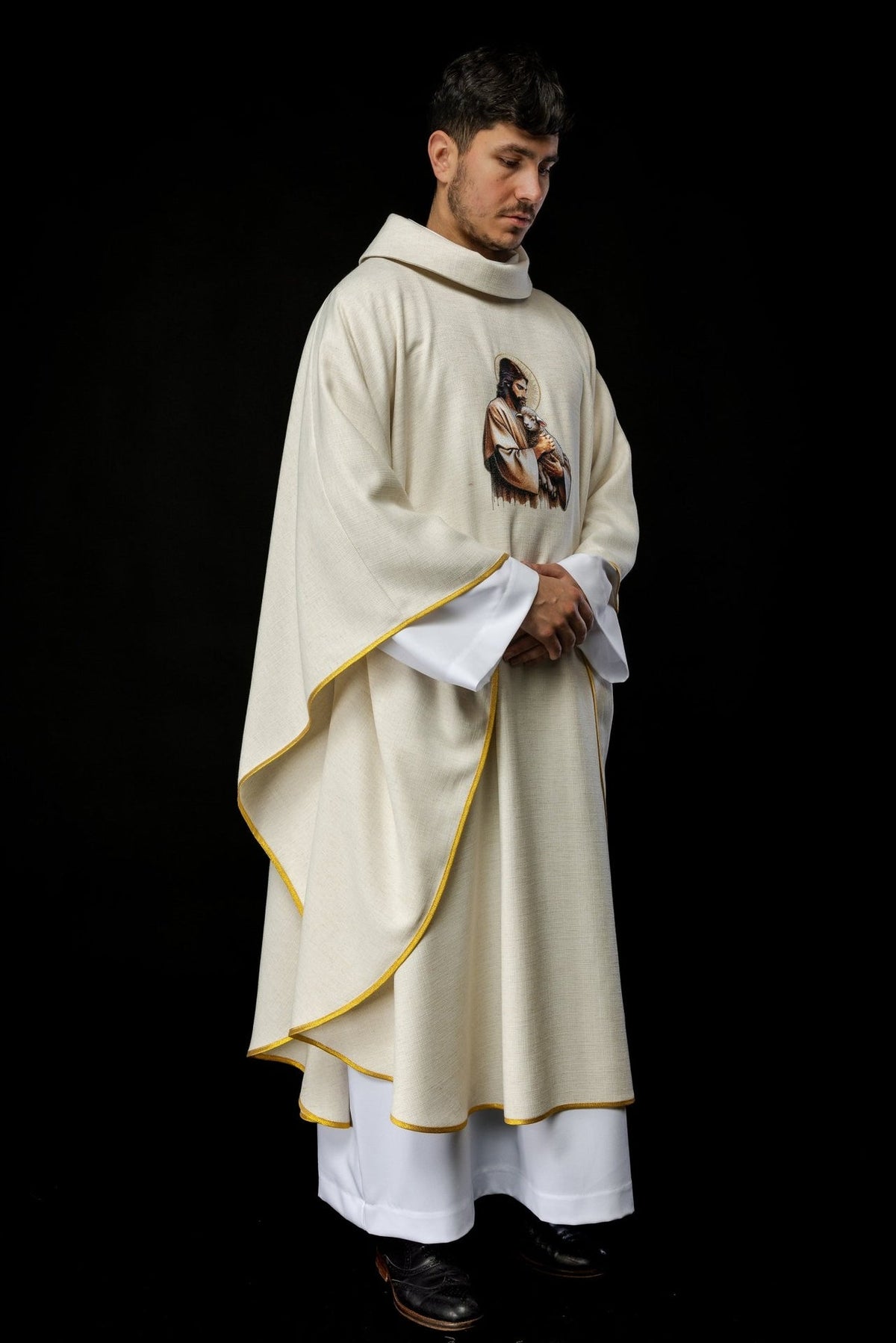 Ecru chasuble three-quarter view with Good Shepherd embroidery
