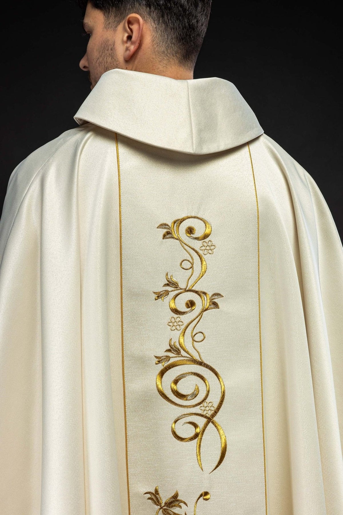 Ecru chasuble back view with gold scroll embroidery and orphrey