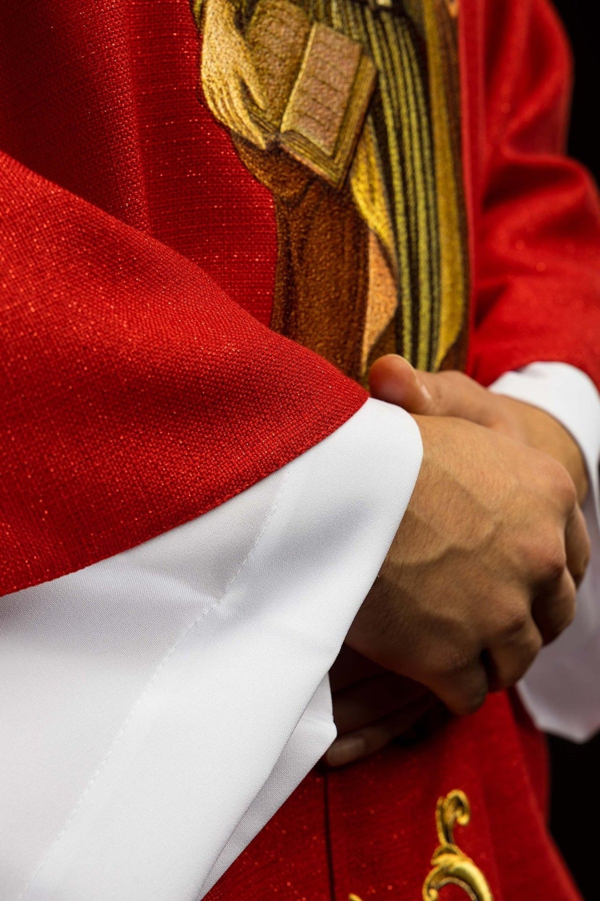 Red chasuble detail showing Saint Peter embroidery and red fabric