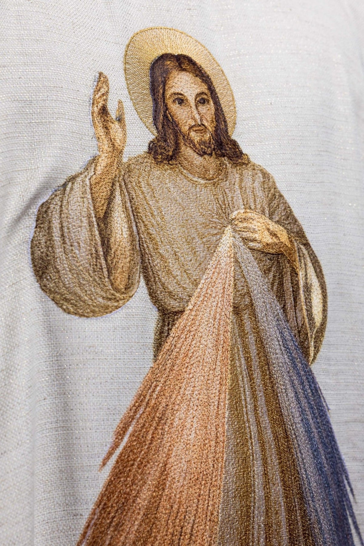 Chasuble close-up showing embroidered Divine Mercy image