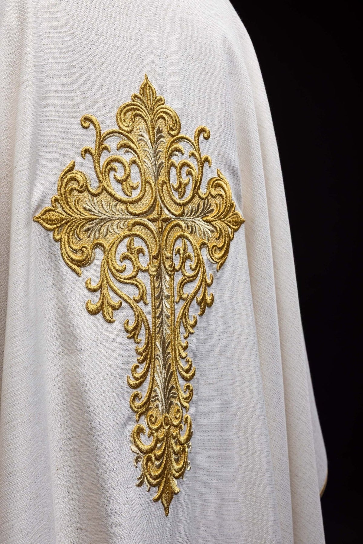 Chasuble back close-up with ornate gold embroidered cross