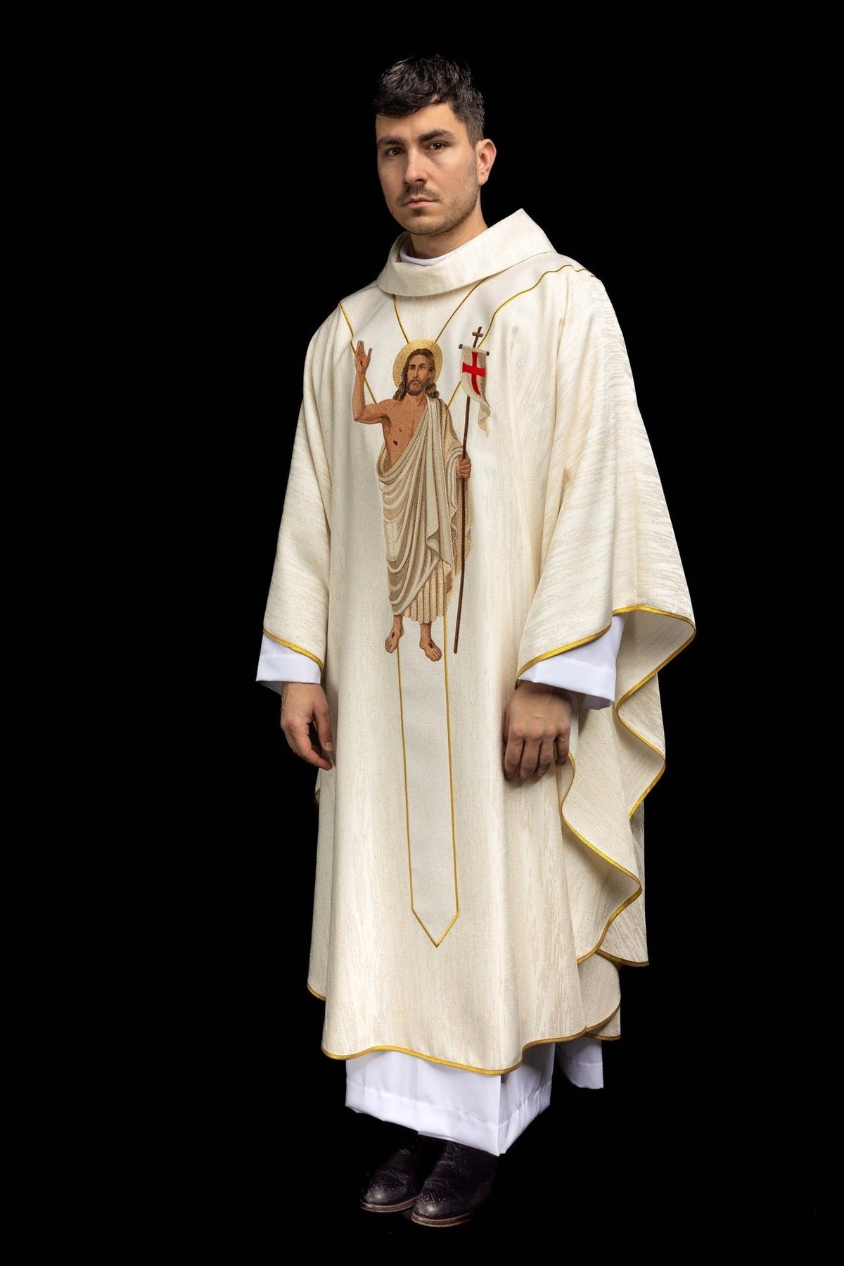 Chasuble side view showing white fabric, gold trim and front embroidery