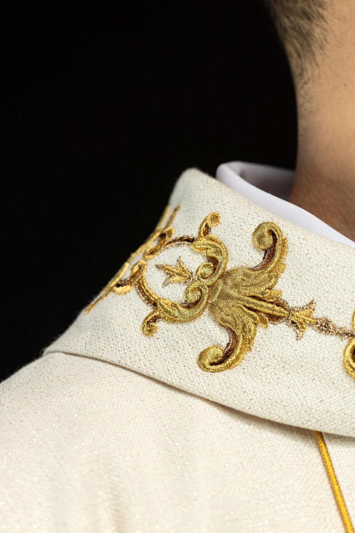 Embroidered chasuble, detail of ecru fabric, gold trim and Our Lady image