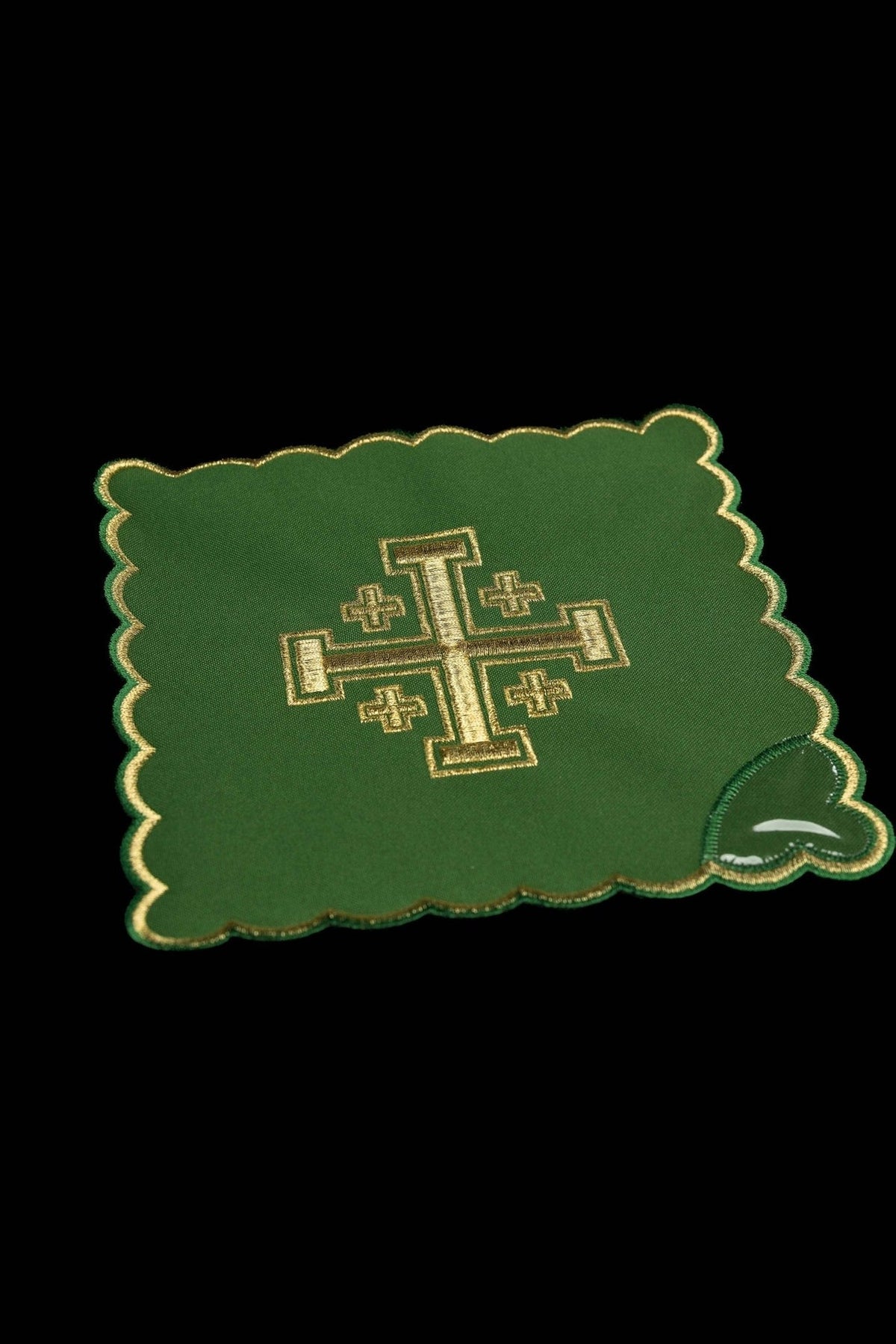 Green chalice pall with gold Jerusalem cross embroidery, close-up view
