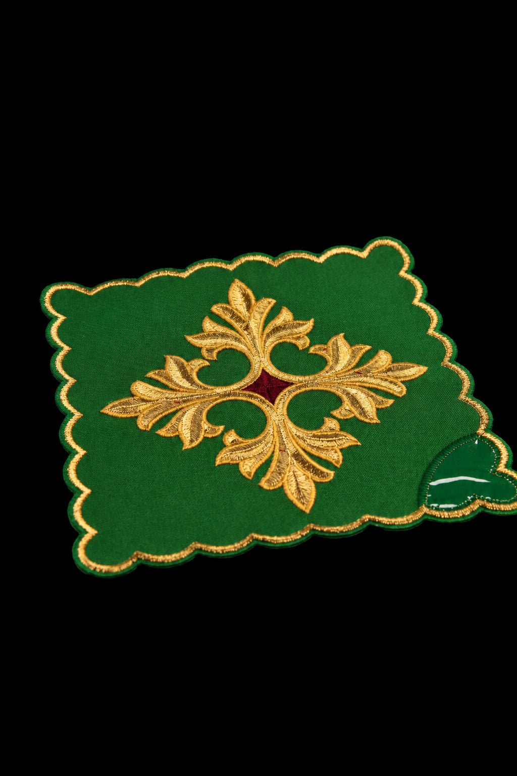 Green chalice pall, close-up of gold embroidered cross and scalloped edge