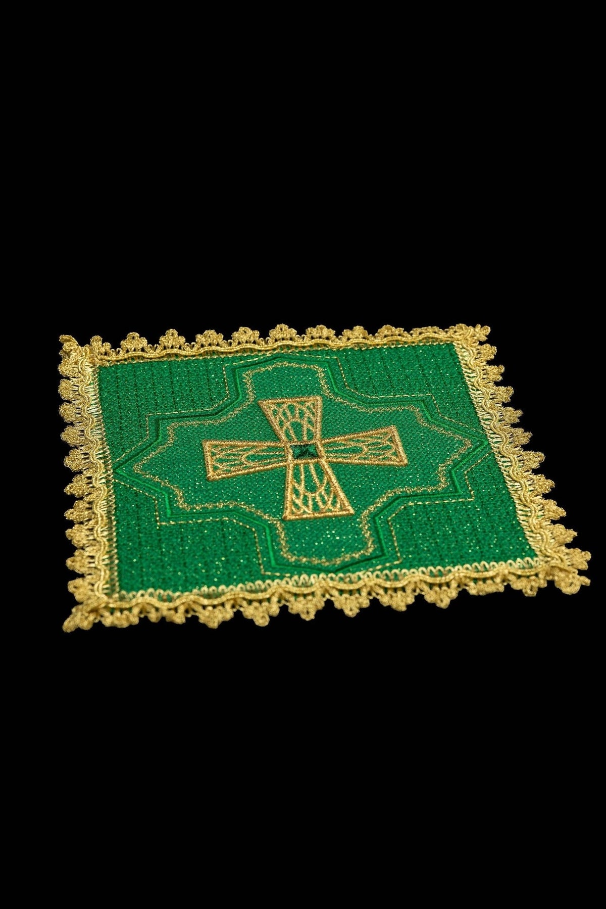 Green chalice pall close-up with embroidered gold cross and ornate gold edging
