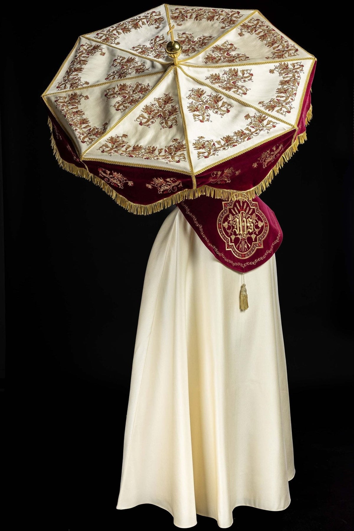 Burgundy and ecru processional umbrella with embroidery, shown open with ornate floral embroidery and gold fringe