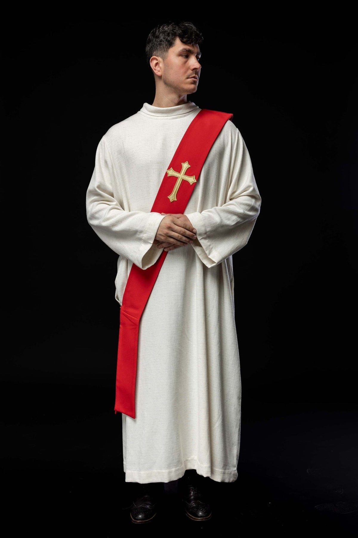 Red deacon stole worn full length, showing embroidered gold cross