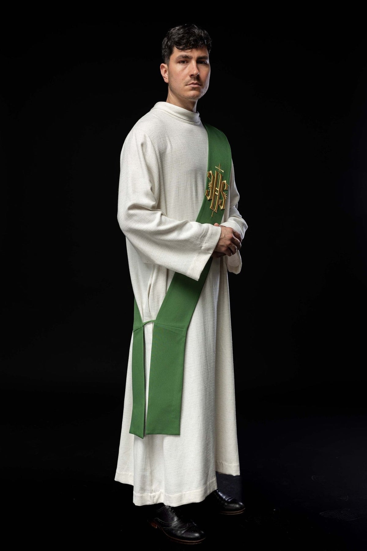 Green deacon stole worn from the side, showing its length and gold embroidery