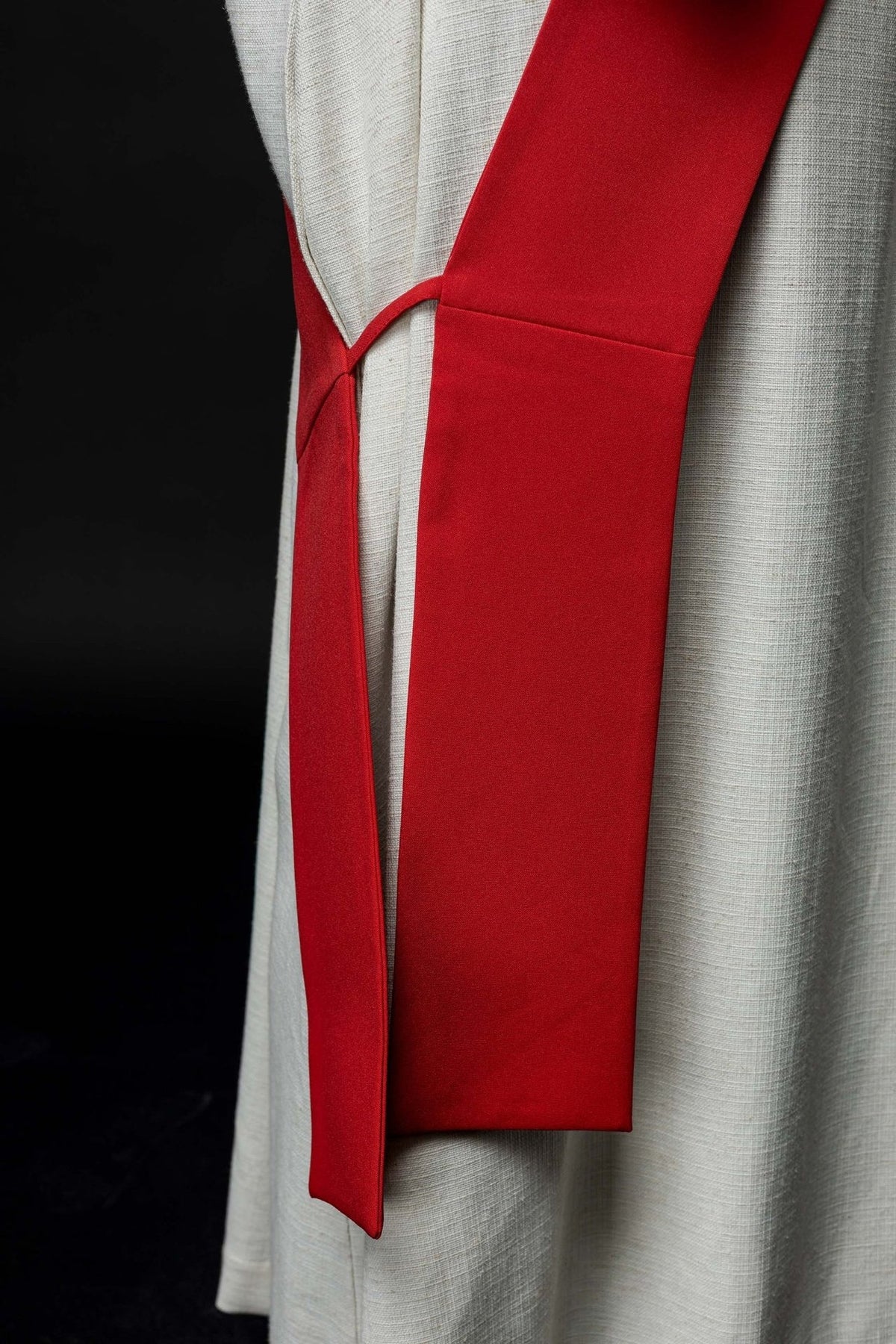Red deacon stole close-up showing plain reverse and joining loop