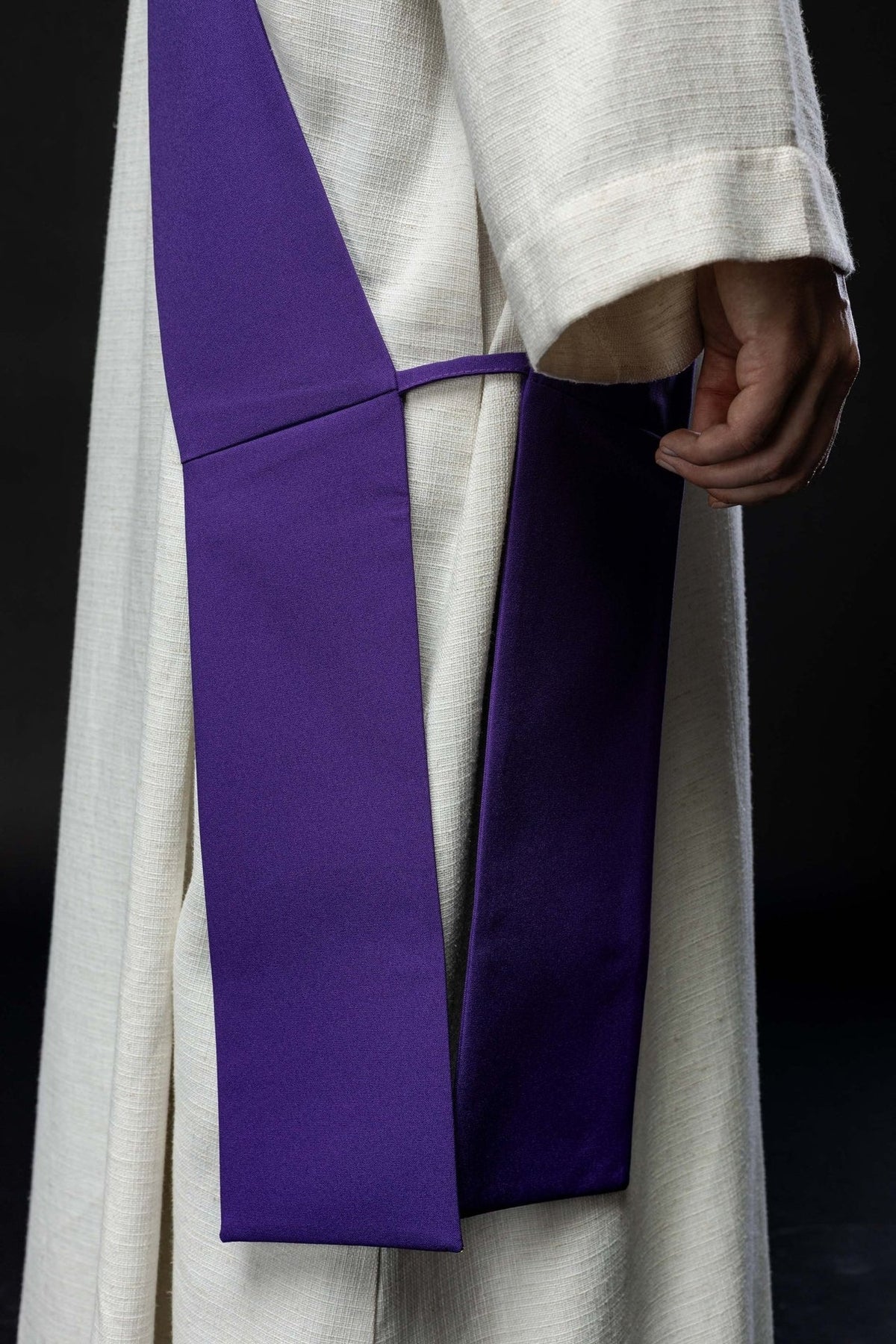 Purple stole back view showing plain fabric, central seam and connecting band