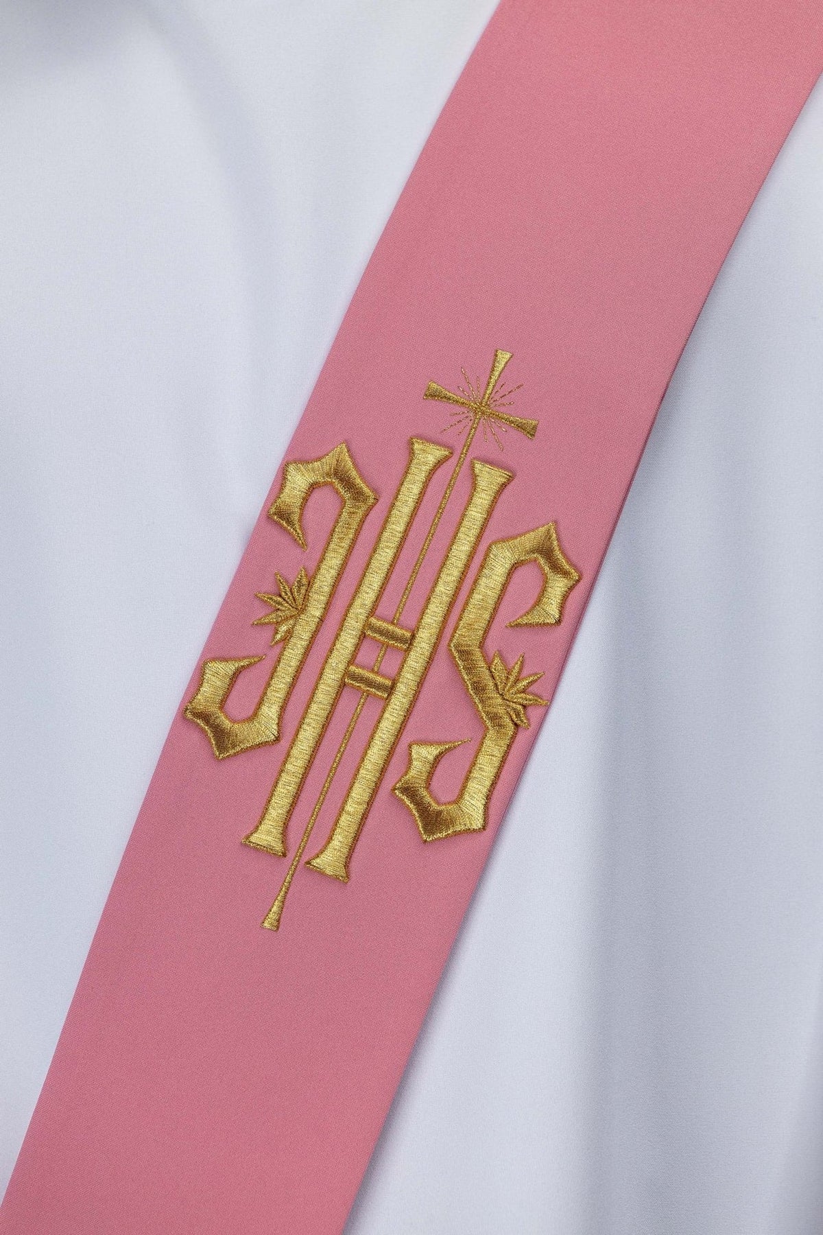 Rose stole close-up showing gold IHS and cross embroidery