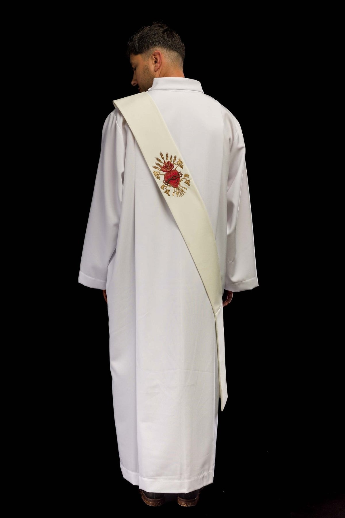 Embroidered deacon stole worn from the back, with the Sacred Heart of Jesus motif visible