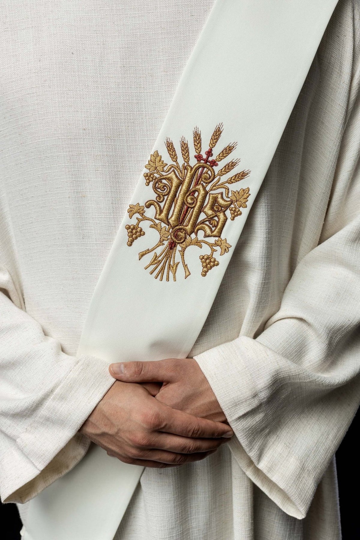 Deacon stole close-up showing gold embroidered grapes, wheat and cross