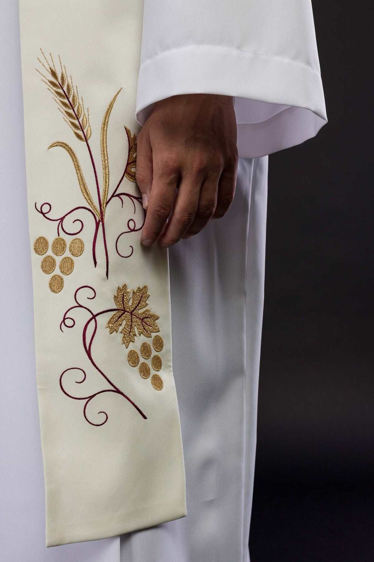 Ecru stole detail showing embroidered wheat and grapes